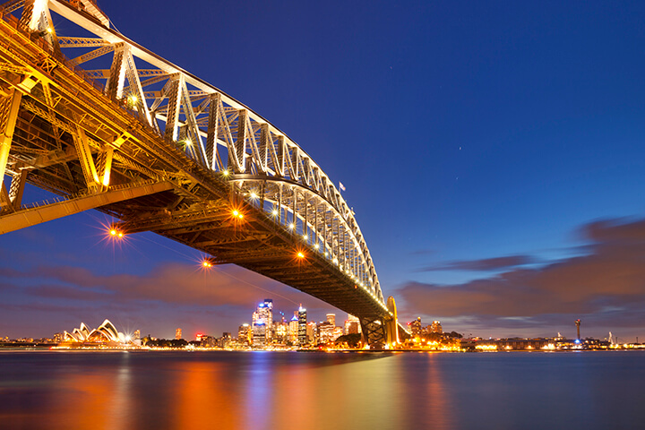 Harbour Bridge and Sydney skyline, Australia at night - Go Next